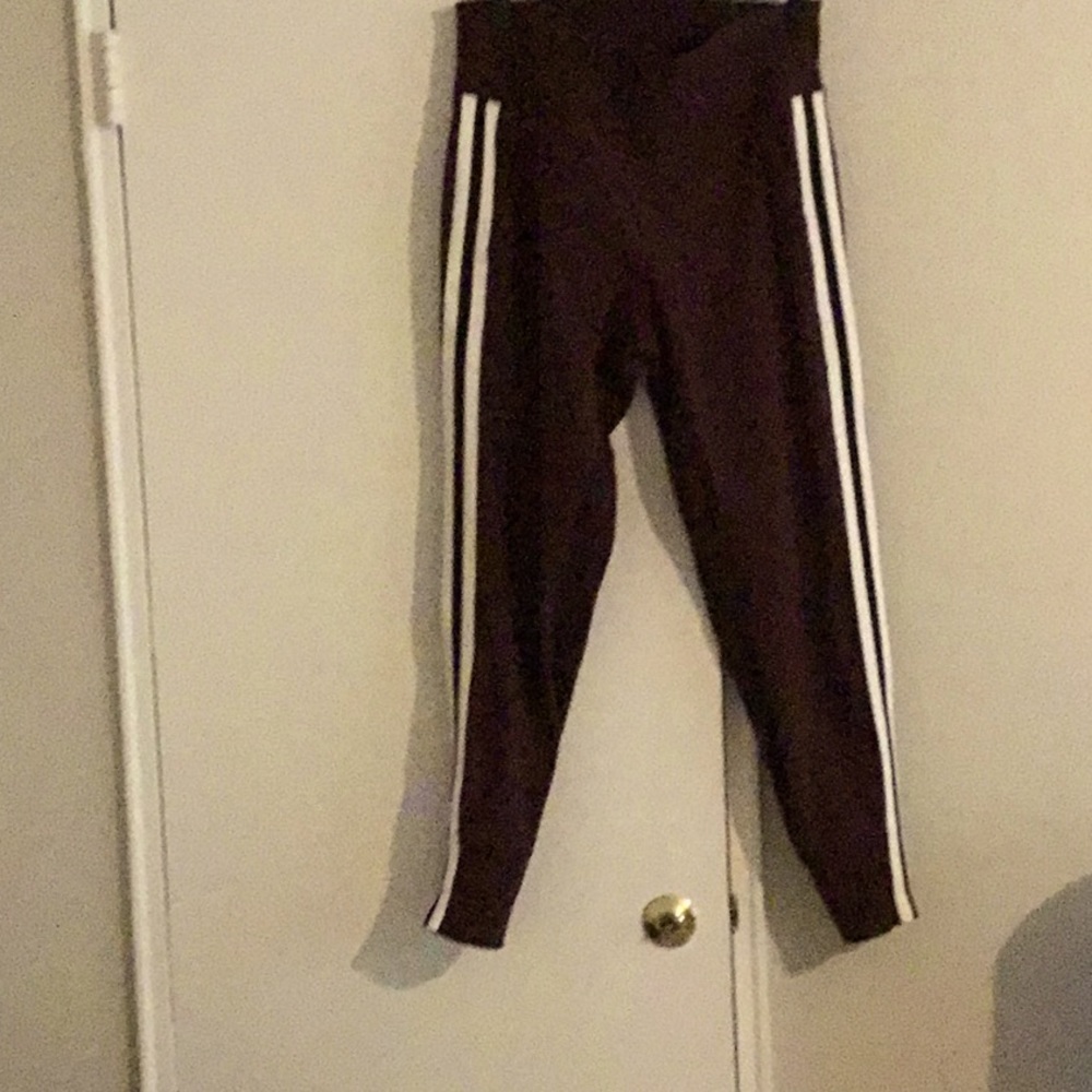 Athleta wine color jogger pants with stripe going down each side like new